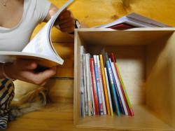 A box with schoolbooks from different countries around the world invites visitors to browse for themselves through different approaches to education Box_Education