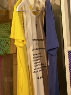 Three T-shirts explain fair trade labels and their positive impact on the clothing industry